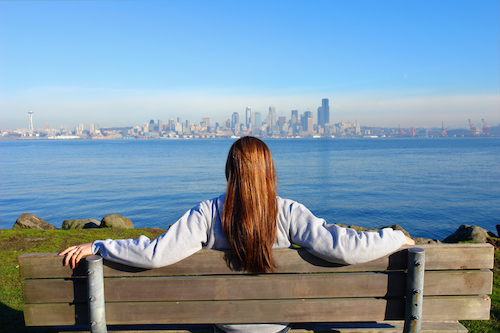 storyblocks girl looking at the city of seattle BoO1j0eTVG